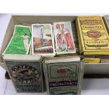 A small collection of cigarette cards , ( poor condition) .