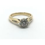 An 18ct yellow gold and diamond cluster ring, appr