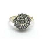 A 9ct gold diamond cluster ring, approx 2.1g and a