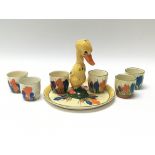 WITHDRAWN - A rare Clarice Cliff egg cup set with duck stand in Crocus pattern