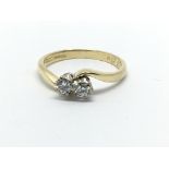 An 18ct gold two stone diamond ring, approx .27ct,