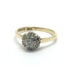 An 19ct gold diamond cluster ring in the form of a