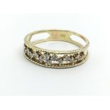 A 14ct gold half eternity open work diamond ring,