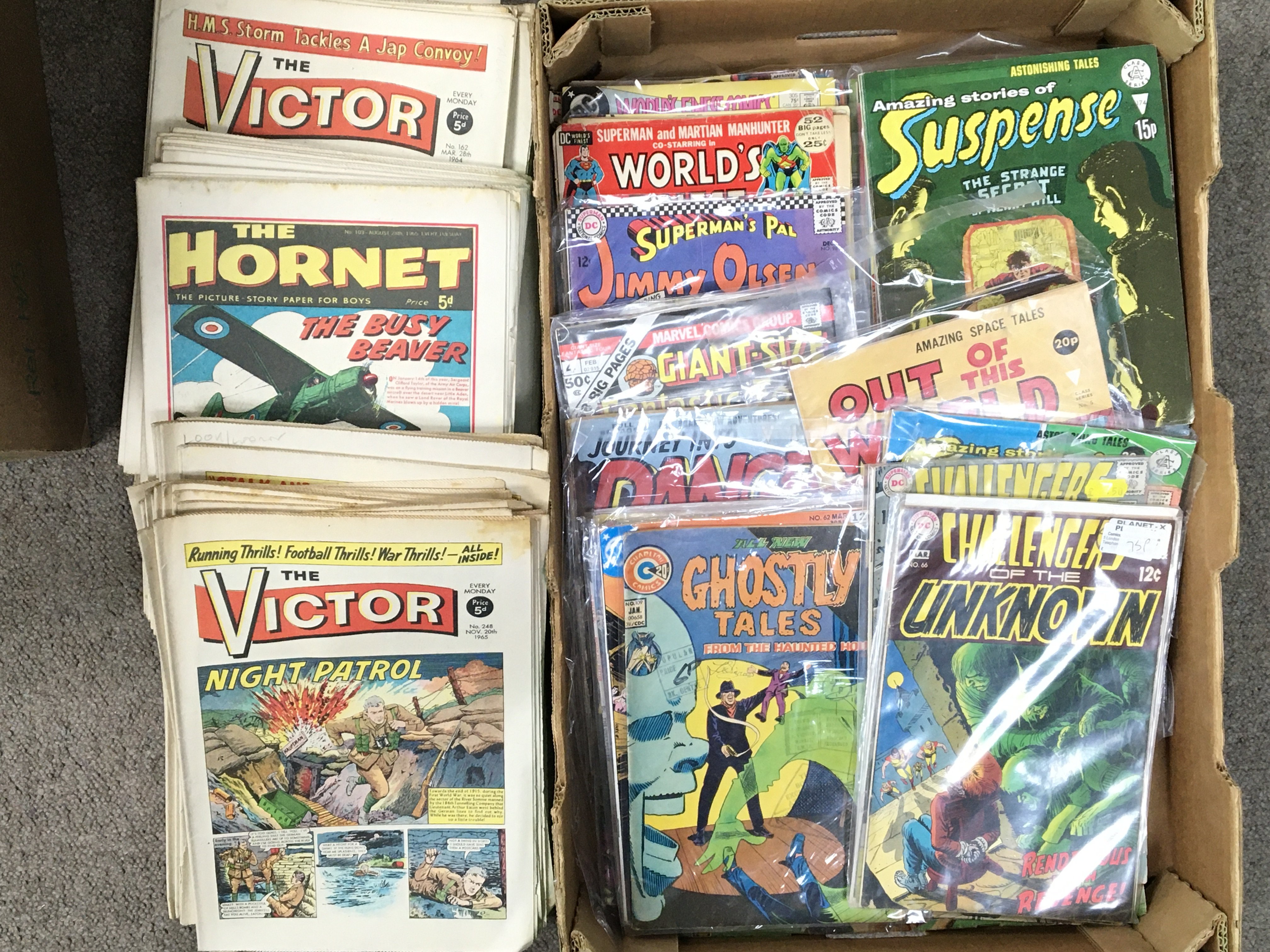 A box containing a collection of sci-fi comics including Challengers of The Unknown, Ghostly