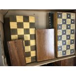 A collection of chess sets and boards