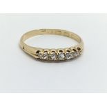 An 18ct gold seven stone diamond ring, approx 1.8g