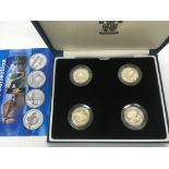A boxed set of four silver proof pattern collection coins.