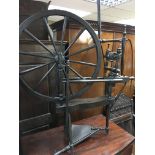 An Antique stained beechwood spinning wheel