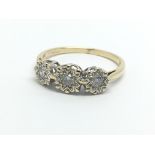 A 9ct gold three stone diamond ring, approx 2.4g a