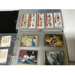 2 albums of cigarette and trade trade cards including Bazooka Joe, German Film cards, and Match