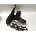 Pair of vintage ice skates and old set of three plated boules in original strap