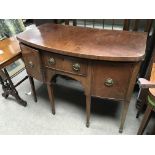 A George III mahogany sideboard fitted with drawers and a cupboard.