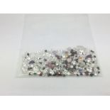 A bag of loose mixed stones including cubic zircon