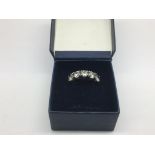 A silver five stone ring, approx size J - NO RESER