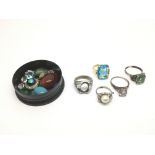 A collection of dress rings and gem stones.