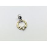 A 9ct white and yellow gold diamond pendant, appro