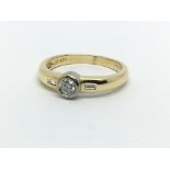 An 18ct gold solitaire diamond ring with diamonds