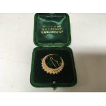 A Quality unmarked Edwardian crescent brooch set with seed pearl.