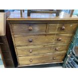 A Victorian walnut veneered 5 draw chest.