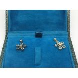 A boxed pair of daisy style earrings set with blue