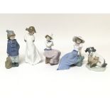 Another collection of five Nao figures including a figure of a dog and a cat