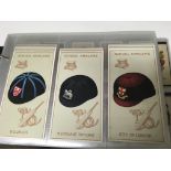 An album of cigarette card sets including Scottish Co Op, Rothmans, Ogdens Etc