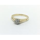 An 18ct gold ring set with four diamonds, approx .