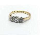 A circa 1930s 18ct gold and platinum three stone d