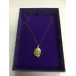 A 9ct gold locket on a 9ct gold chain, approx 3g.