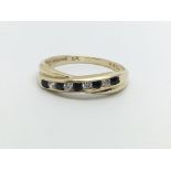 A 9ct gold sapphire and diamond half eternity twis