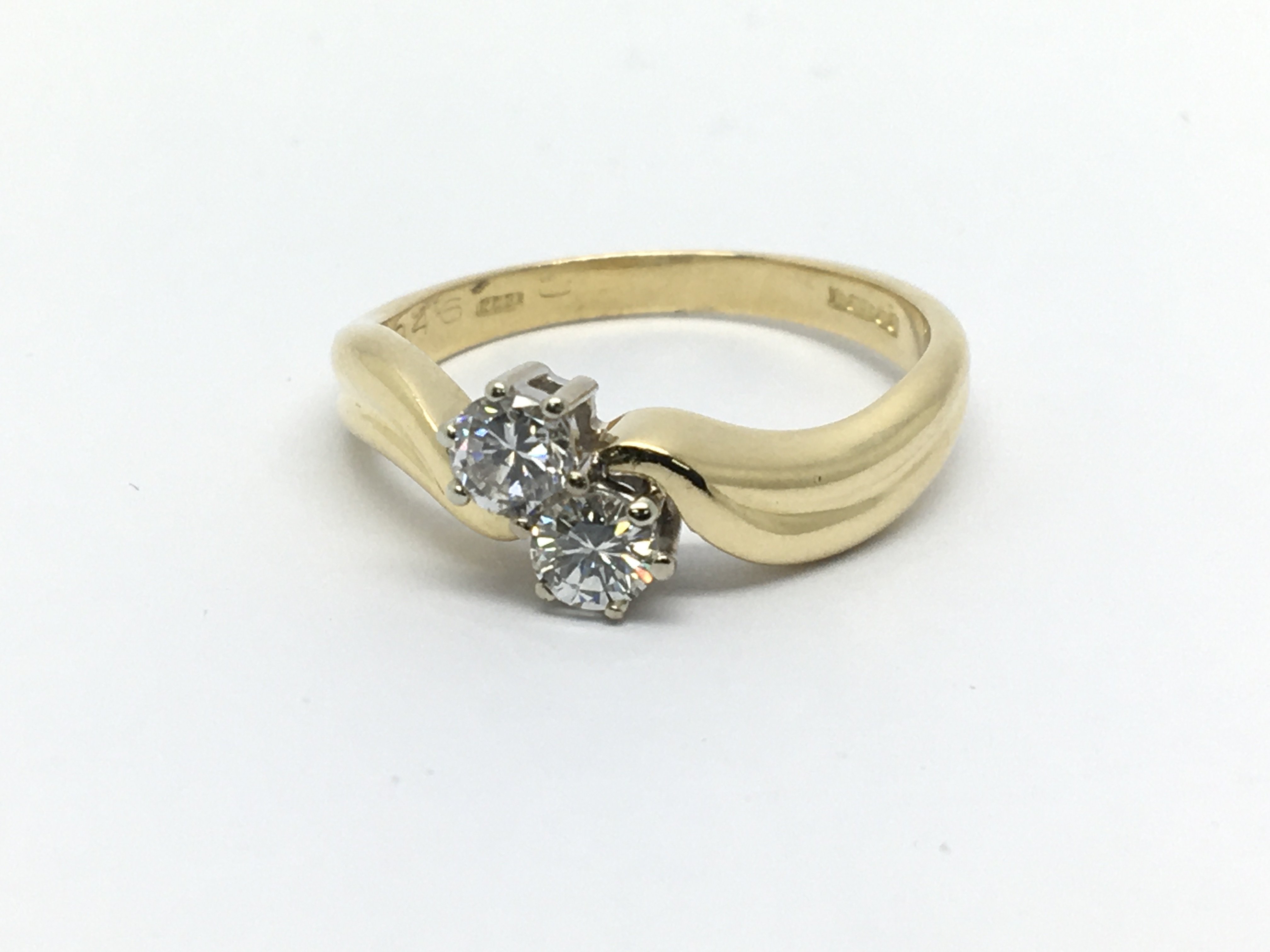 An 18ct gold two stone diamond ring, approx 1/2ct,