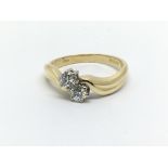 An 18ct gold two stone diamond ring, approx 1/2ct,