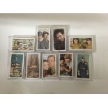 A collection of 9 sets of cigarette cards