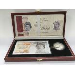 A boxed Queen Elizabeth II 70th birthday proof set comprising a £10 coin and a £10 bank note.