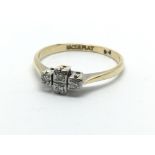 An 18ct gold and platinum diamond ring set with four small diamonds, approx 2.4g and approx size N.