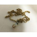 A 9carat gold rope chain weight 6g with an attached opal pendent (opal cracked)