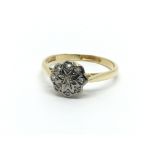 A 1930s 18ct gold ring set with diamonds in the fo
