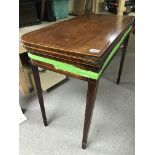 A 19th Century mahogany card table with fruitwood