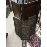 A Mahogany folding screen Hight 97cm and three carved oak panels (4)