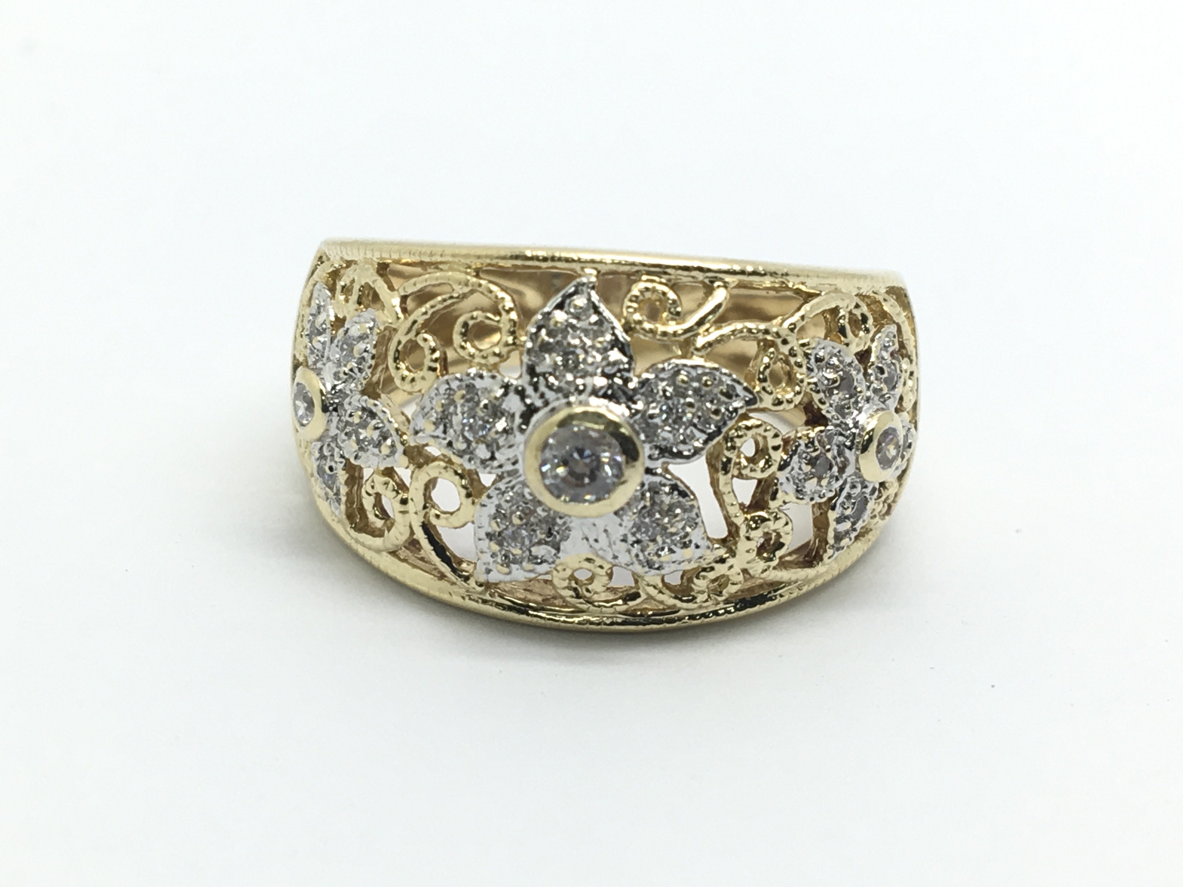 A 14ct gold diamond ring in the form of three flow