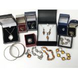 A collection of various silver jewellery items including earrings, bracelets, rings and necklaces,