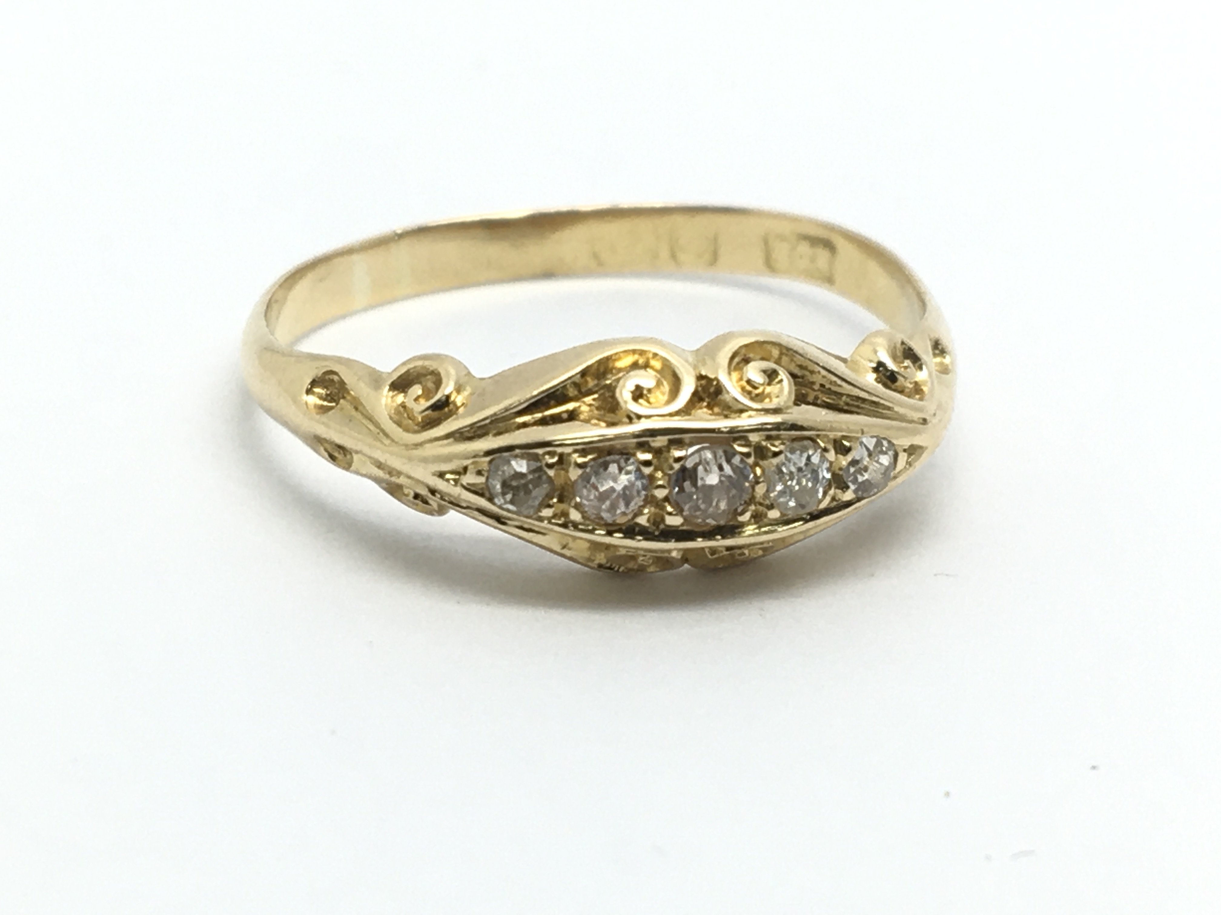 A vintage 18ct gold five stone diamond ring, appro