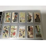 An album of cigarette card sets including Ogdens ABC of sport