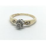 A 9ct gold diamond cluster ring in the form of a flowerhead, approx 1/4ct, approx 1.9g and approx