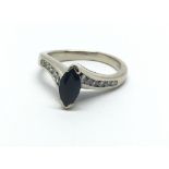 An 18ct white gold marquis shape sapphire and diam
