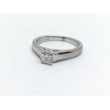 An 18ct white gold emerald cut solitaire diamond r