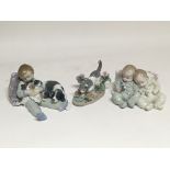 A collection of four Lladro figures of babies, children and animals together with Lladró
