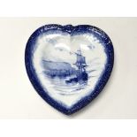 A Royal Crown Derby heart shaped plate decorated in blue and white ship scene by W.E.J. Dean