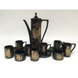 A Portmeirion Phoenix pattern black and gold coffee set, consisting of coffee pot, six cups and