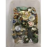 A box of mixed badges.